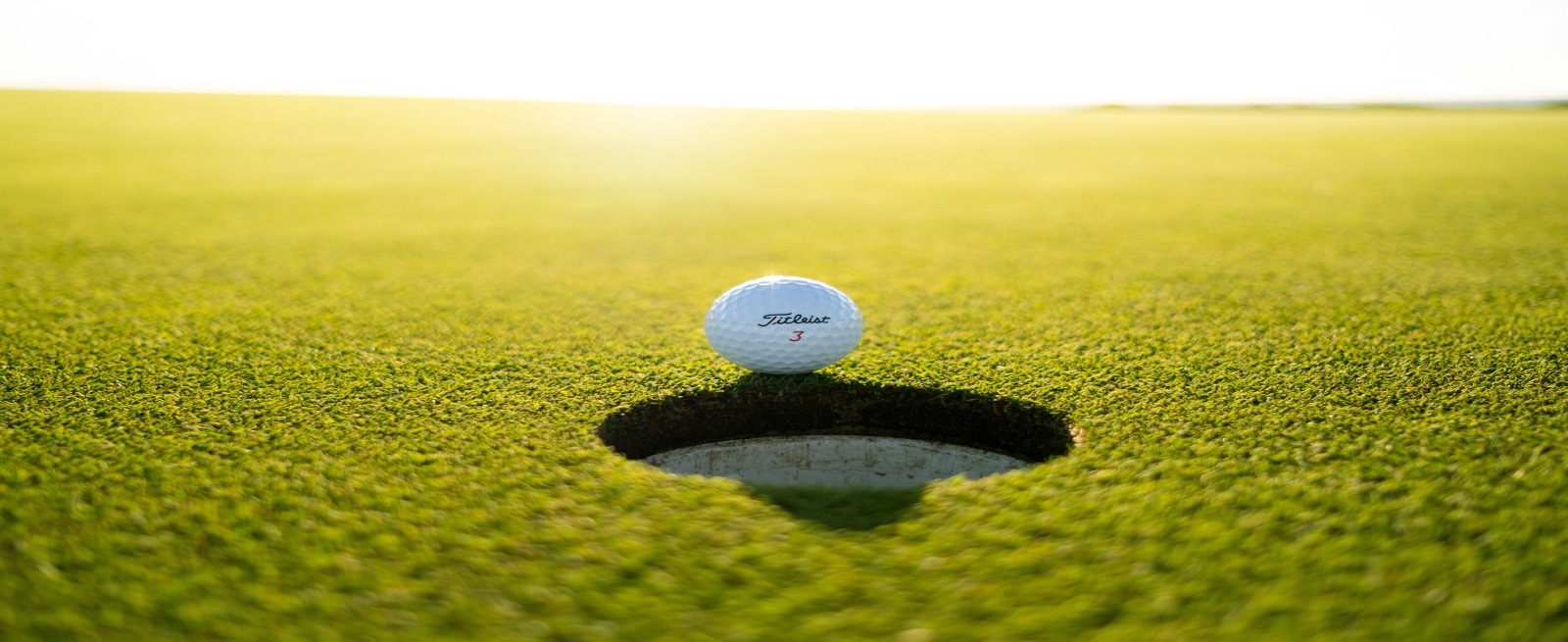 a golf ball on a golf green
