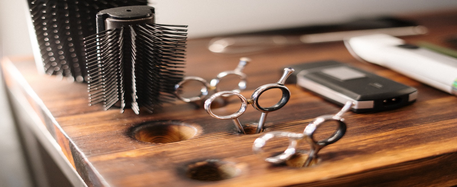 hair salon tools in a wooden block