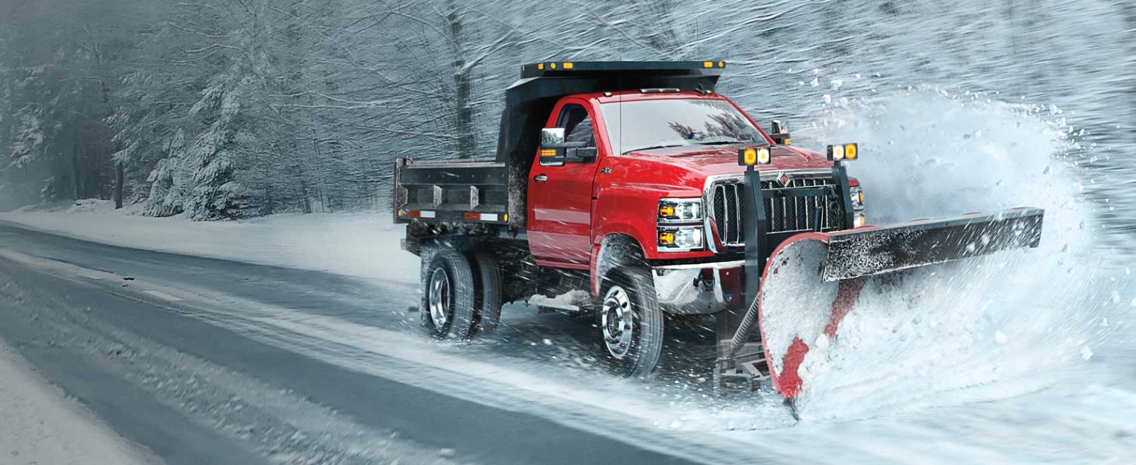 plow truck plowing a road