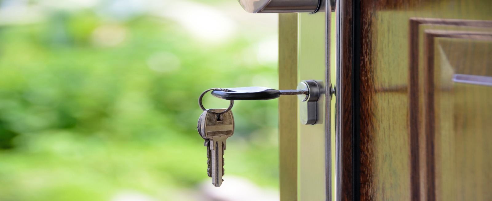 keys hanging in the lock of a door