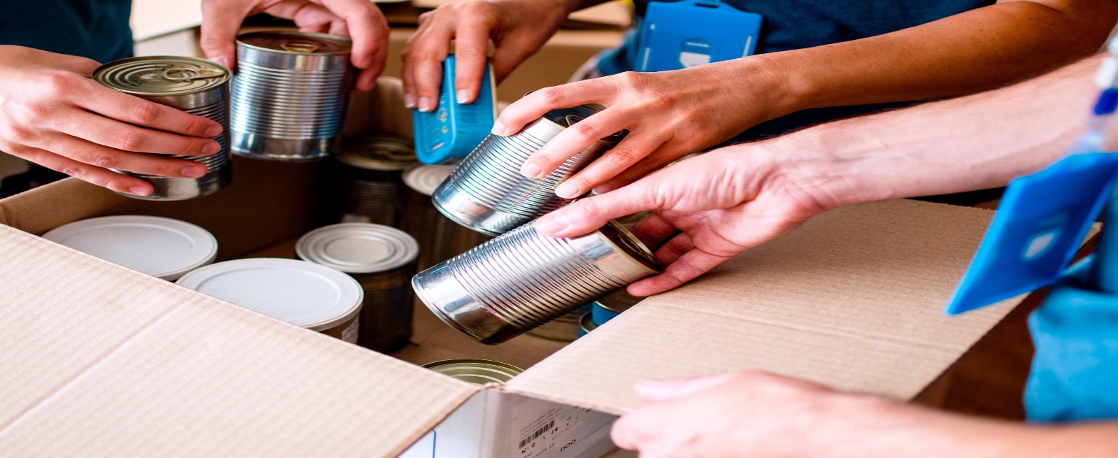 canned goods being put in a box