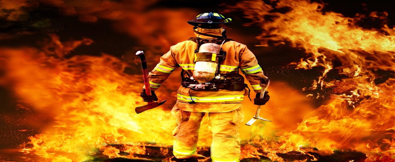 Fire fighter walking through fire