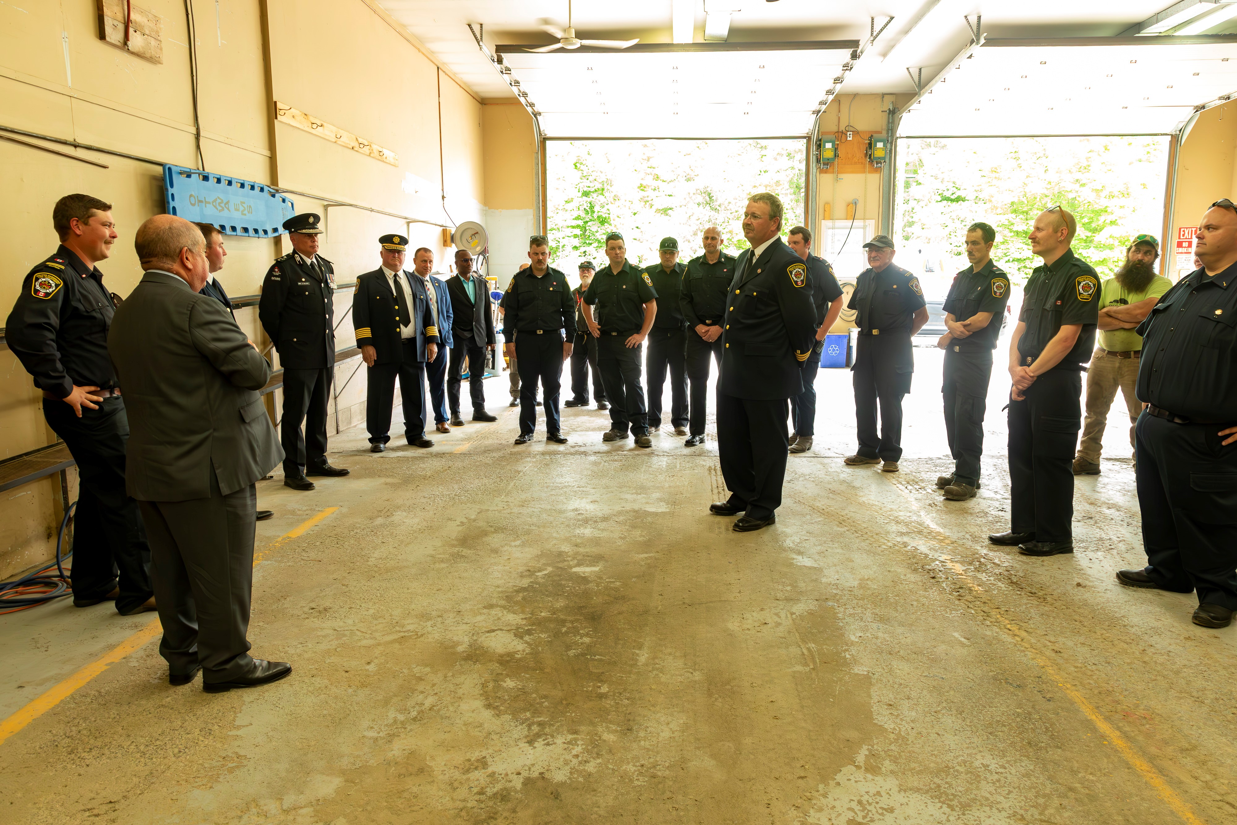 group of firefightersstanding in fire hall