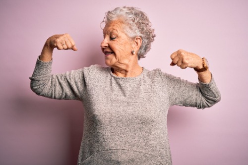 Senior flexing her muscles