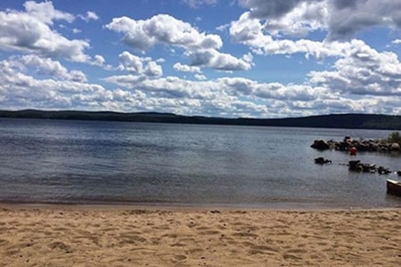 beach lake water blue sky clouds