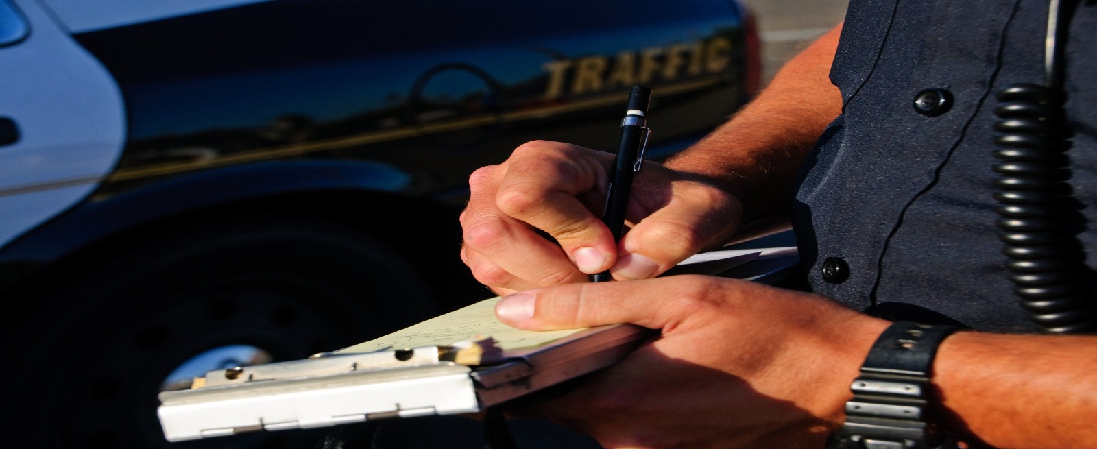 By-law enforcement writing a ticket